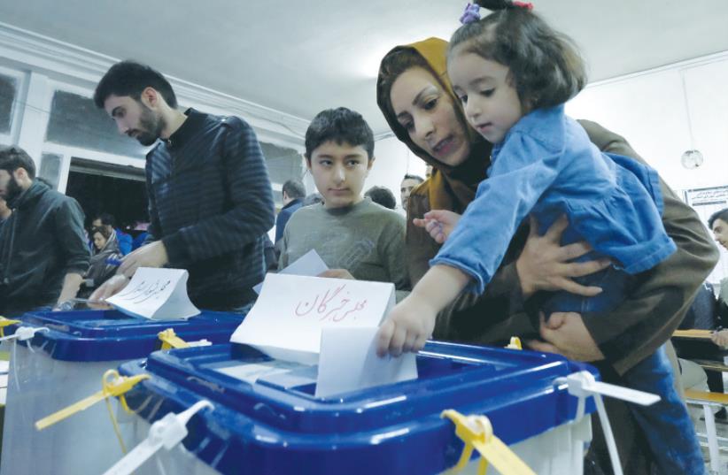 PEOPLE VOTE for parliament and the Assembly of Experts in Tehran. (photo credit: REUTERS/RAHEB HOMAVANDI)