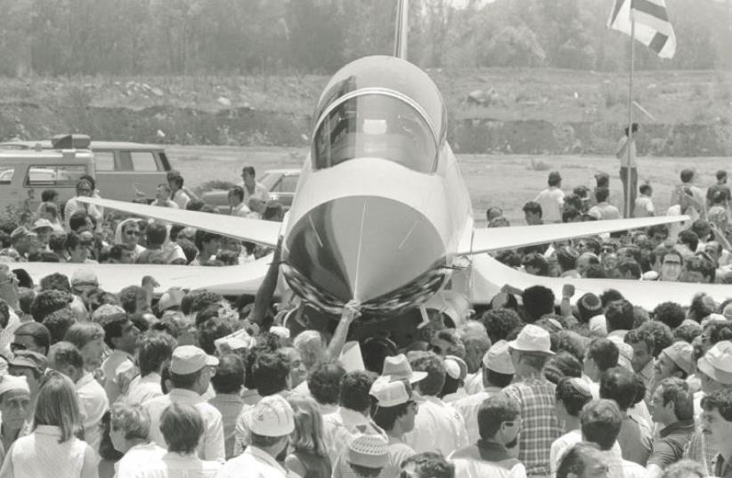 Proud IAI workers crowd around the Lavi after the rollout ceremony at the Israel Aircraft Industries complex in Lod in 1986 (photo credit: NATI HARNIK/GPO)