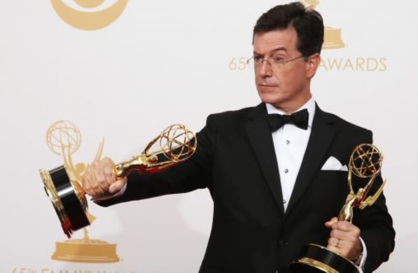 Stephen Colbert poses backstage at the 65th Primetime Emmy Awards in Los Angeles, September 22, 2013 (photo credit: REUTERS)