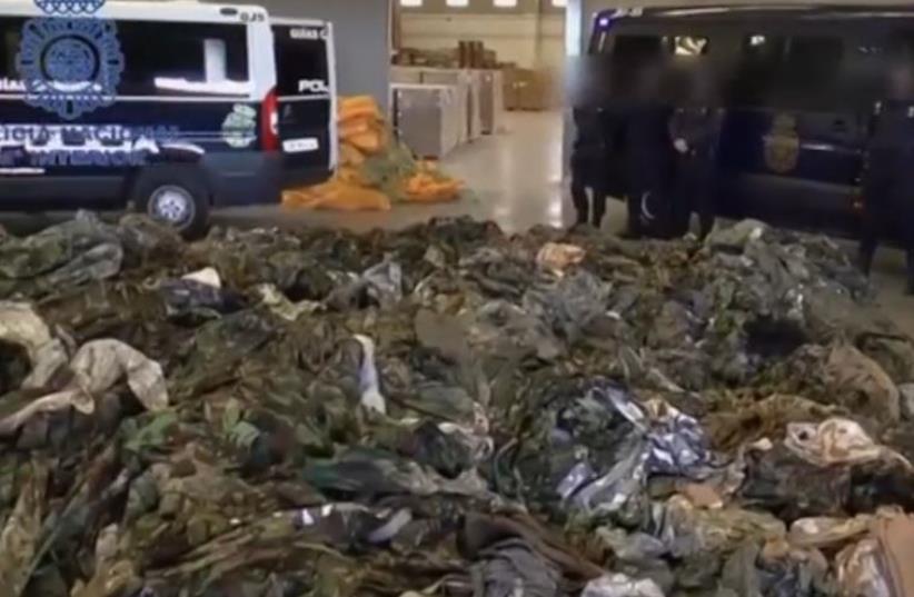 Spanish police seize 20,000 uniforms bound for Islamic State (photo credit: SCREENSHOT/REUTERS)