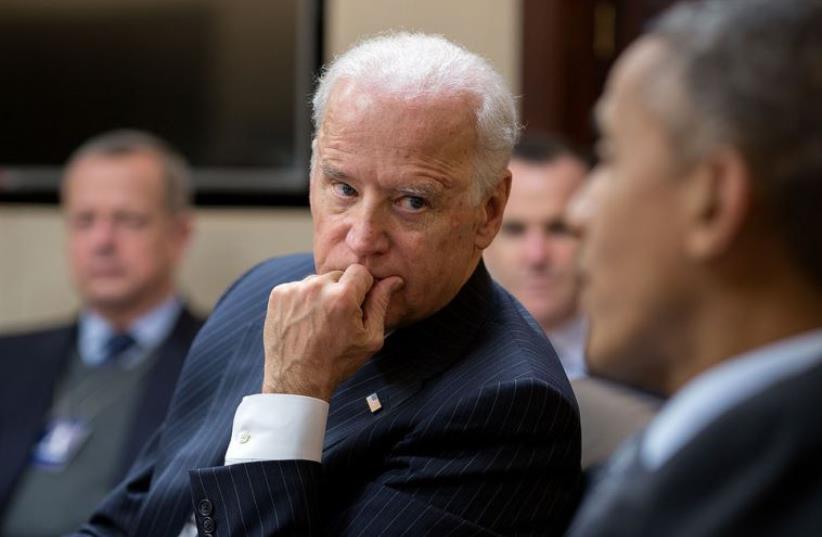 Vice President Joe Biden listens to President Barack Obama in the White House (photo credit: OFFICIAL WHITE HOUSE PHOTO / PETE SOUZA)