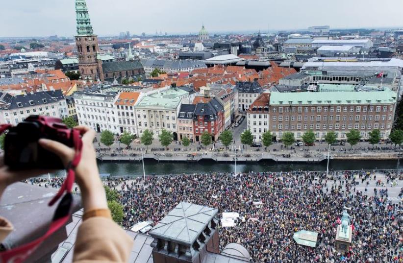 People show their support for refugees and migrants during a rally in Copenhagen September 12, 2015.  (photo credit: REUTERS)