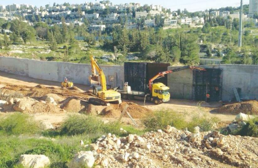 CONSTRUCTION VEHICLES prepare a housing site in the capital’s Ramat Shlomo neighborhood last week. (photo credit: COURTESY PEACE NOW)