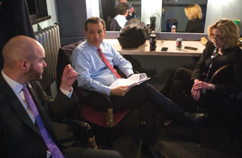 GOP CANDIDATE Ted Cruz meets with his national security adviser Victoria Coates and chief political strategist Jason Johnson prior to last week’s debate in Detroit (photo credit: CHRIS CORRADO)