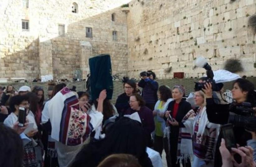 Women of the Wall with Torah scroll in women's section of the Western Wall, March 11, 2016 (photo credit: WOMEN OF THE WALL)