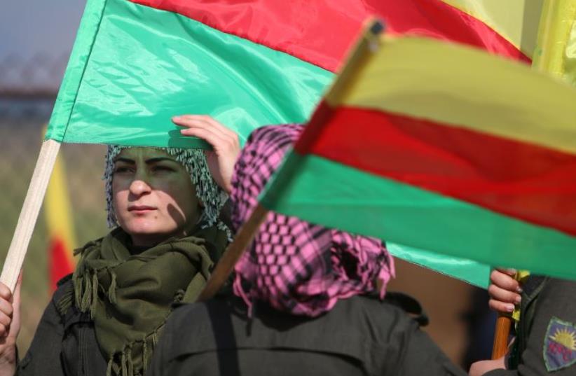 Kurds protesting near Syrian-Turkish border (photo credit: REUTERS)