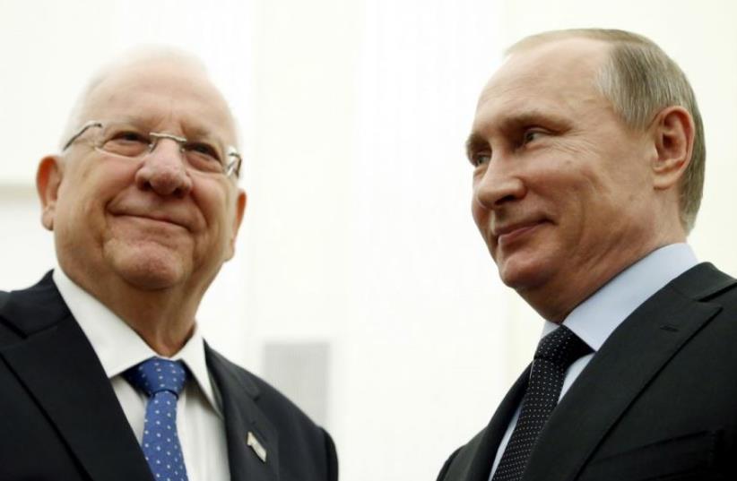 Russia's President Vladimir Putin (R) meets with his Israeli counterpart Reuven Rivlin at the Kremlin in Moscow (photo credit: REUTERS)