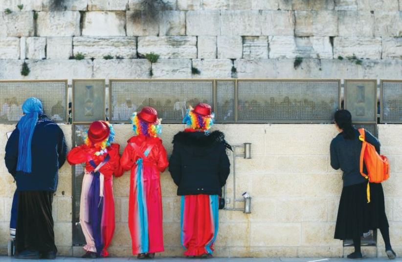 Children in costumes visit the Western Wall last Purim (photo credit: REUTERS)