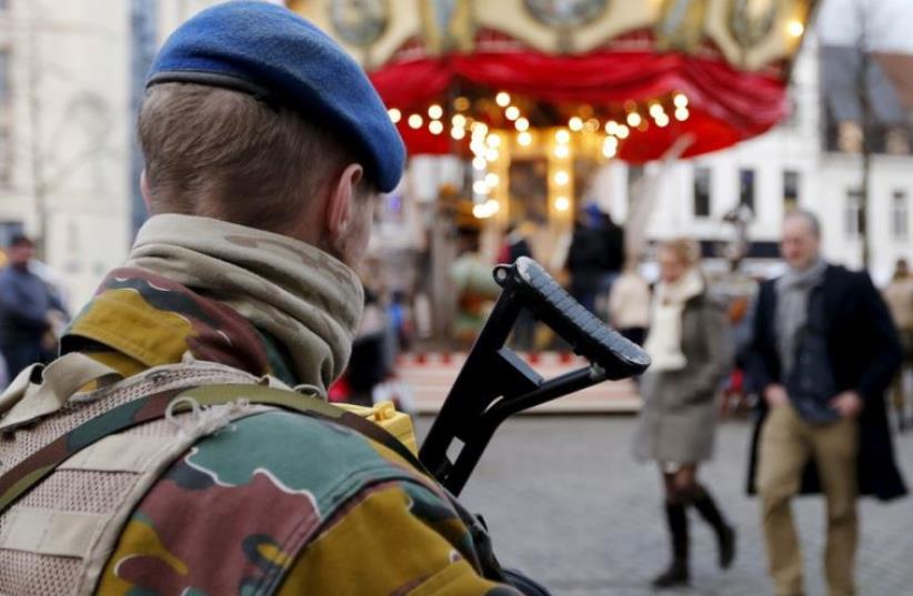 A Belgian soldier patrols the streets of Brussels (photo credit: REUTERS)
