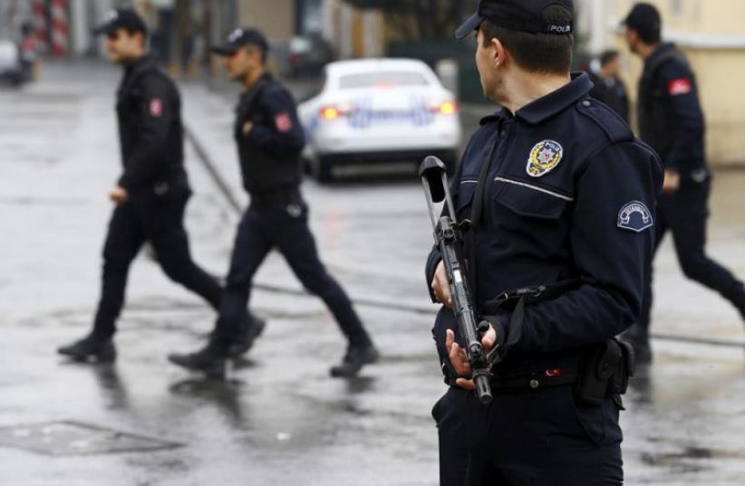 A police officer secures the area following a suicide bombing in Istanbul