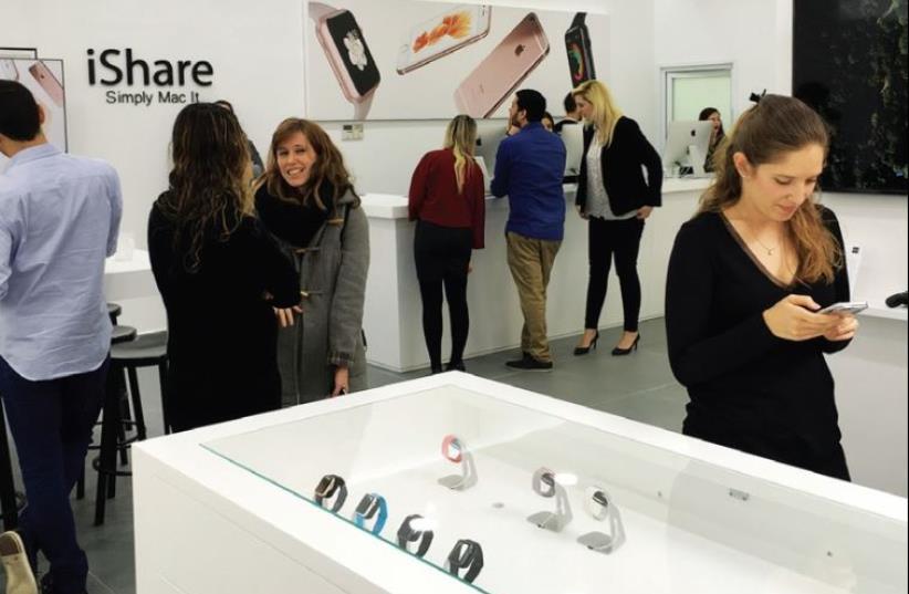 Checking out the new iShare store in Florentin (photo credit: ORIT ARFA)