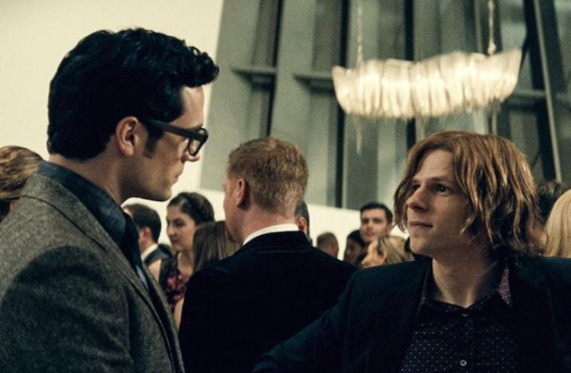Henry Cavill, left, as Clark Kent, and Jesse Eisenberg as Lex Luthor in “Batman v. Superman: Dawn of Justice.”  (photo credit: COURTESY OF WARNER BROS. PICTURES/DC COMICS)
