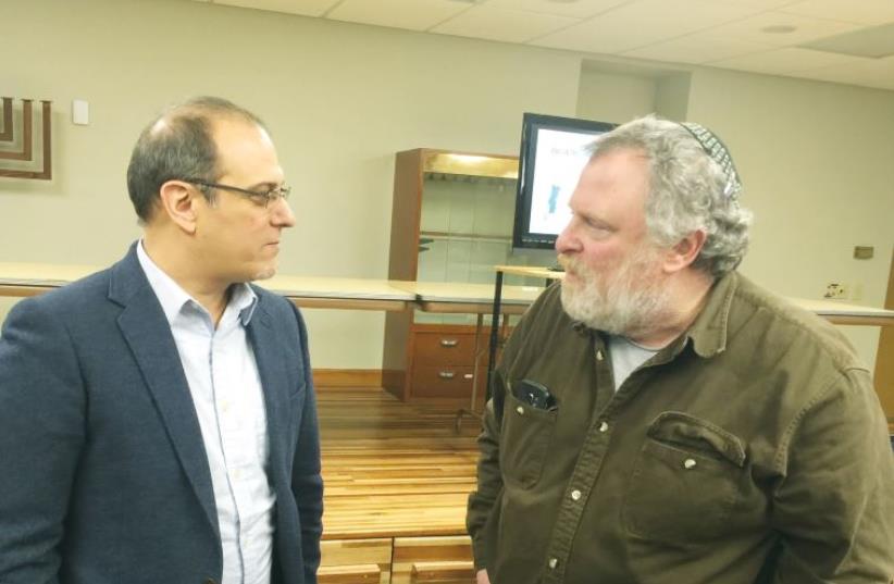 Prof. Jesus Jambrina (left) gives a presentation on uncovering Zamora’s Jewish past at the La Crosse Synagogue, Wisconsin, on March 6 (photo credit: Courtesy)