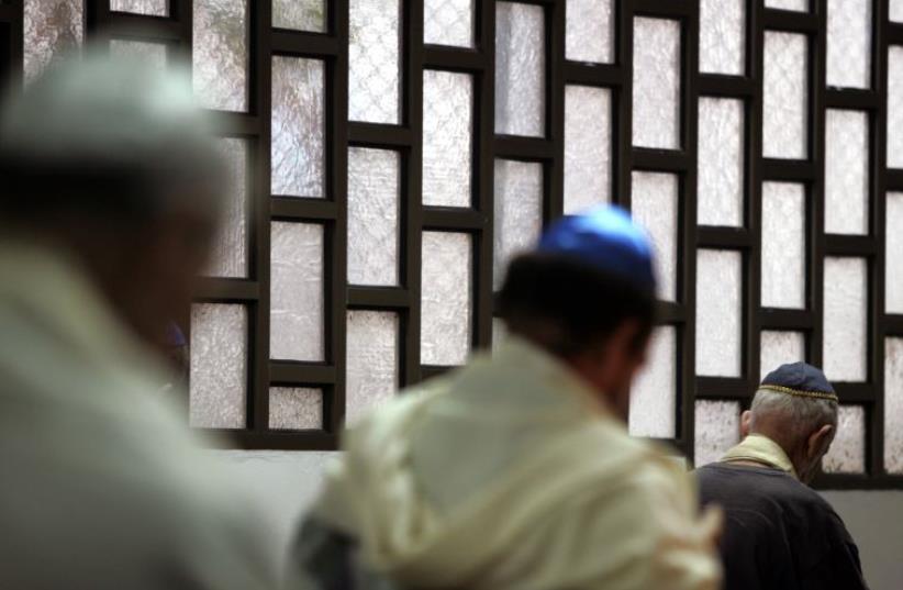 Men of the Cuban Jewish community attend a service at a synagogue in Old Havana  (photo credit: REUTERS)