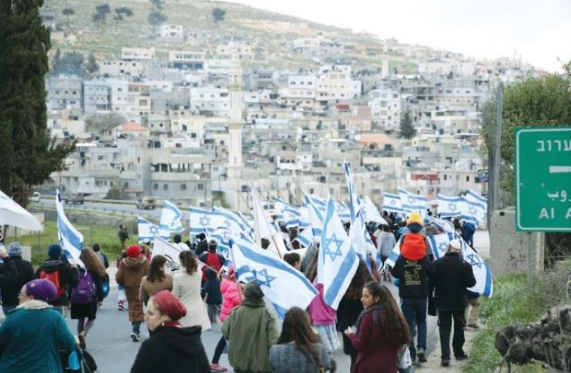 In protest against the recent wave of terror, the leadership of communities in Judea and Samaria hold a march covering six kilometers on Highway 60 (photo credit: MIRIAM TZACHI)