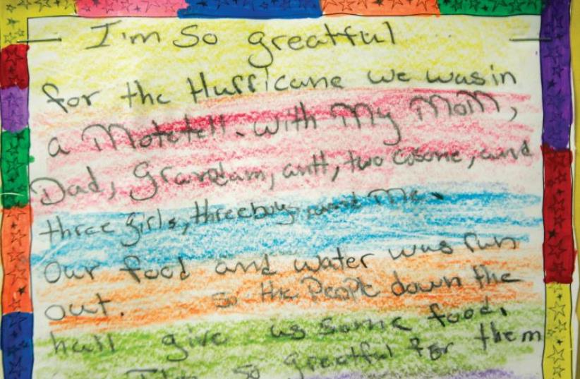 A CHILD’S note, written after Hurricane Katrina, expresses gratitude for food and water, for a motel, for his family and for the people who helped them. (photo credit: REUTERS)