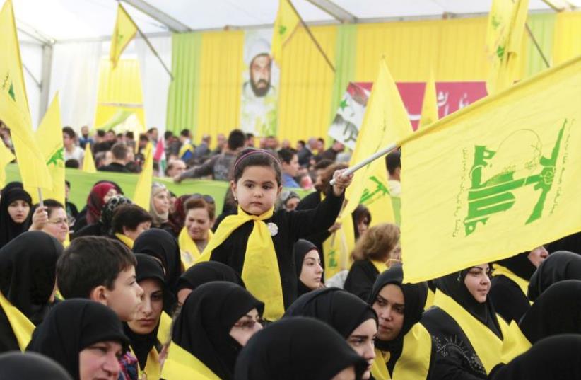 ‘HOLA, QUE TAL?’ Hezbollah flags at a rally – could these be flying in Latin America soon? (photo credit: REUTERS)