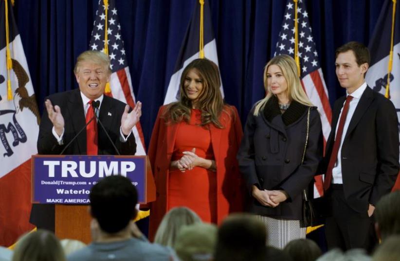 US Republican presidential candidate Donald Trump speaks as (L-R) his wife Melania, daughter Ivanka and Ivanka's husband Jared Kushner listen (photo credit: REUTERS)