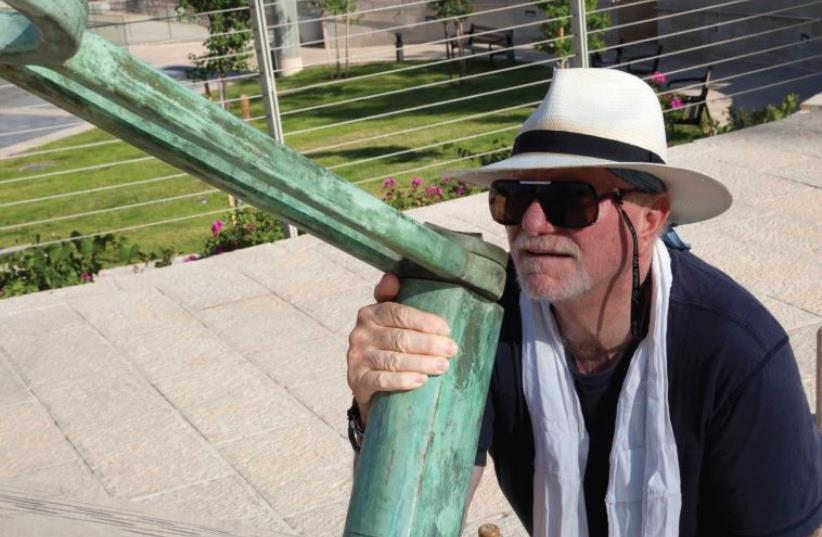 LOCAL SCULPTOR and painter Maty Grunberg with his sundial at Teddy Kollek Park in Jerusalem. (photo credit: RAN EDRE)