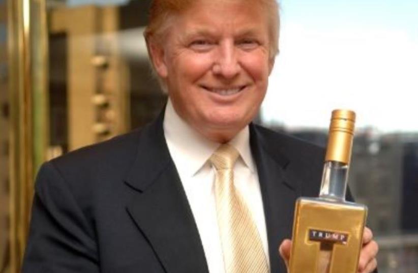 Donald Trump holds a bottle of the vodka named after him (photo credit: Courtesy)
