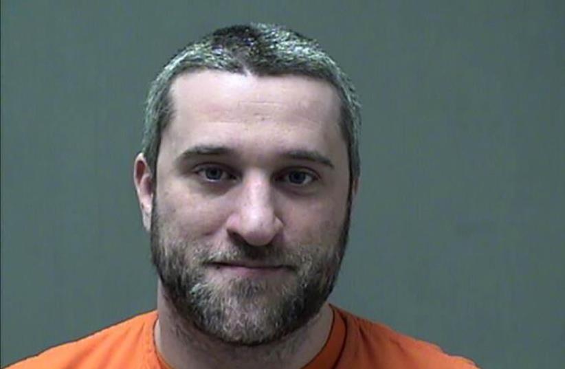 Actor Dustin Diamond is seen in an undated booking photo released by the Ozaukee County Sheriff's Office, in Port Washington, Wisconsin (photo credit: REUTERS)