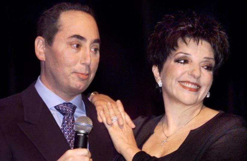 Singer Liza Minnelli and David Gest (left) in 2002 (photo credit: REUTERS)