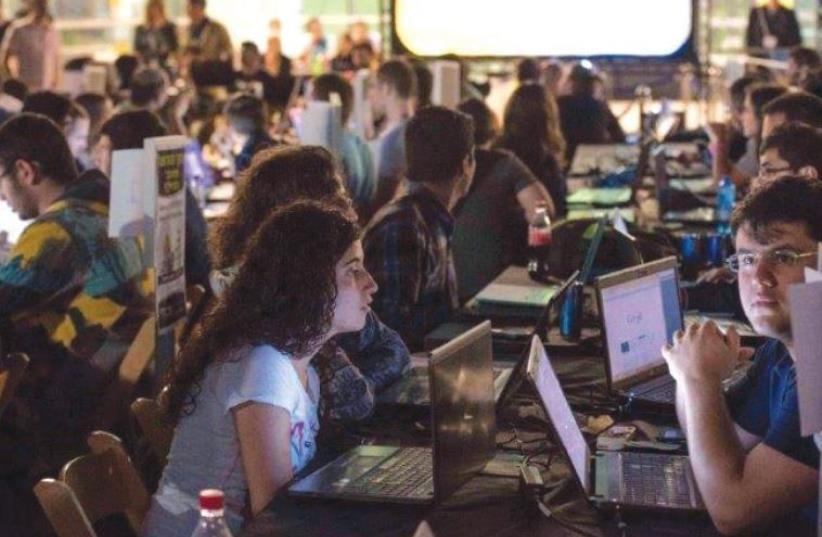 SOME OF THE 400 participants in the the second annual Cyber (K)night hackathon that took place at the First Station in Jerusalem last week. (photo credit: Courtesy)