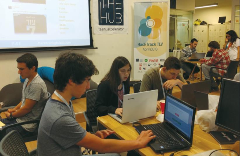 SOME 100 of Israel’s young hi-tech entrepreneurs gather in Tel Aviv Port over the weekend to develop innovative applications at HackTrack TLV. (photo credit: NAAMAH ZALCMAN)