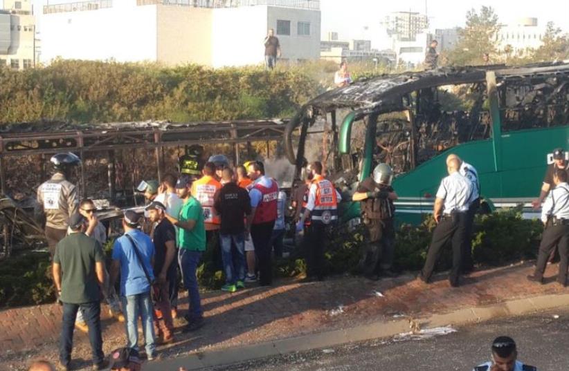 Scene of exploded bus in Jerusalem, April 18, 2016 (photo credit: MARC ISRAEL SELLEM)