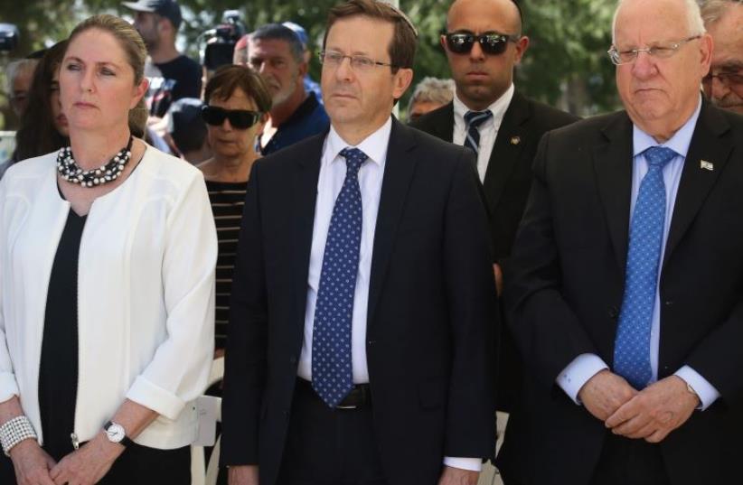 LABOR LEADER Isaac Herzog is flanked by his wife, Michal, and President Reuven Rivlin (photo credit: MARC ISRAEL SELLEM)