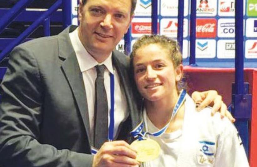 Timna Nelson Levy (right) and coach Shany Hershko pose yesterday with the bronze medal she won at the European Judo Championships in Kazan, Russia. (photo credit: Courtesy)