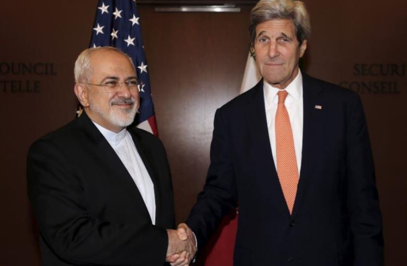 US Secretary of State John Kerry (R) meets with Iran's Foreign Minister Mohammad Javad Zarif at UN headquarters in New York (photo credit: REUTERS)