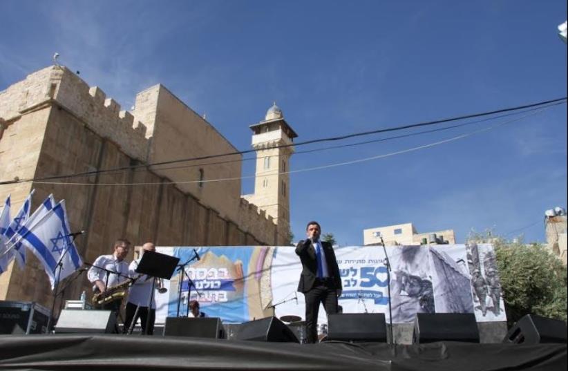 Singer on stage in front of the Cave of the Patriarchs at the annual Passover festival in Hebron. (photo credit: TOVAH LAZAROFF)