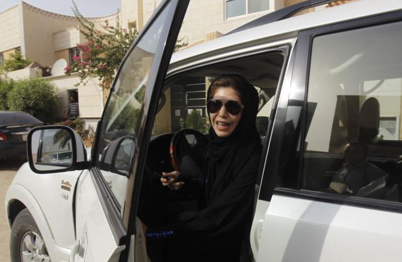 Female driver Azza Al Shmasani alights from her car after driving in defiance of the ban in Riyadh June 22, 2011.  (photo credit: REUTERS)