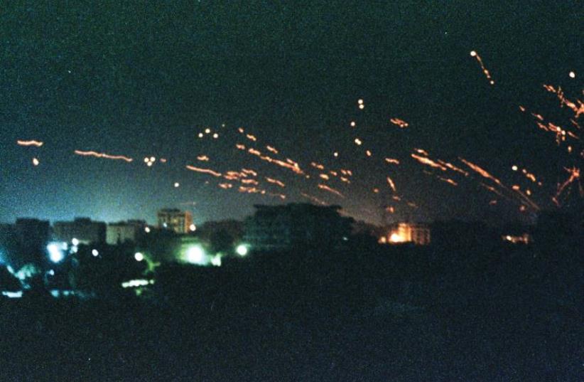 Iraqi anti-aircraft fire and tracer flares light up the sky above Baghdad on January 17, 1991, as US and allied bombing raids launched the Gulf War to liberate Kuwait (photo credit: REUTERS)
