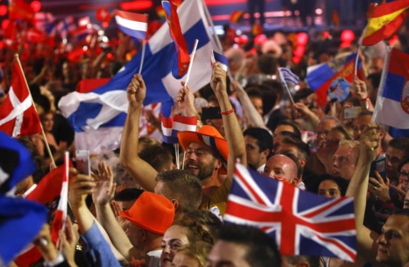 Fans wave flags during the Eurovision song contest in Vienna, May 19, 2015 (photo credit: REUTERS)