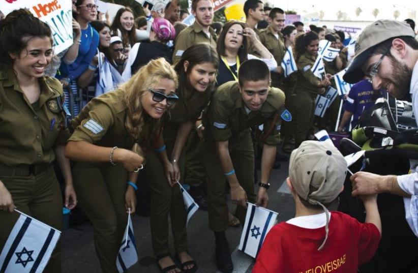 NEW OLIM arriving at Ben-Gurion Airport (photo credit: REUTERS)