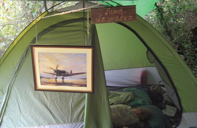 A sign reading ‘My Intimate Tent’ hangs above Oren Cahanovitc’s offbeat residence (photo credit: OREN CAHANOVITC)