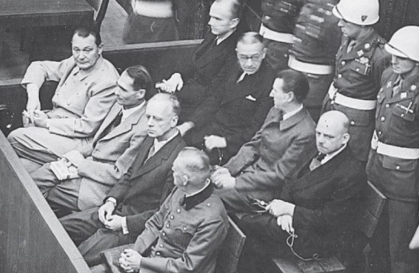 Nazi defendants (from left to right) Hermann Goering, Rudolf Hess, Joachim von Ribbentrop and Wilhelm Keitel sit in the dock of their warcrimes trial at Nuremberg in 1946 (photo credit: REUTERS)