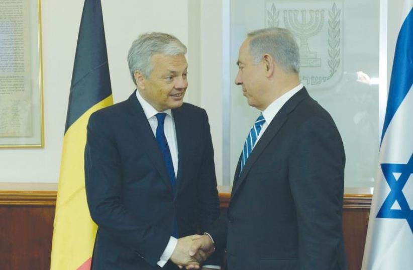 PRIME MINISTER Benjamin Netanyahu welcomes Belgian Foreign Minister Didier Reynders to his Jerusalem office (photo credit: GPO)