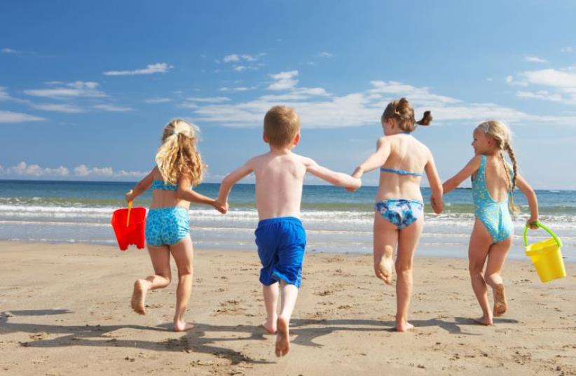 Children on beach vacation (illustrative) (photo credit: ING IMAGE/ASAP)