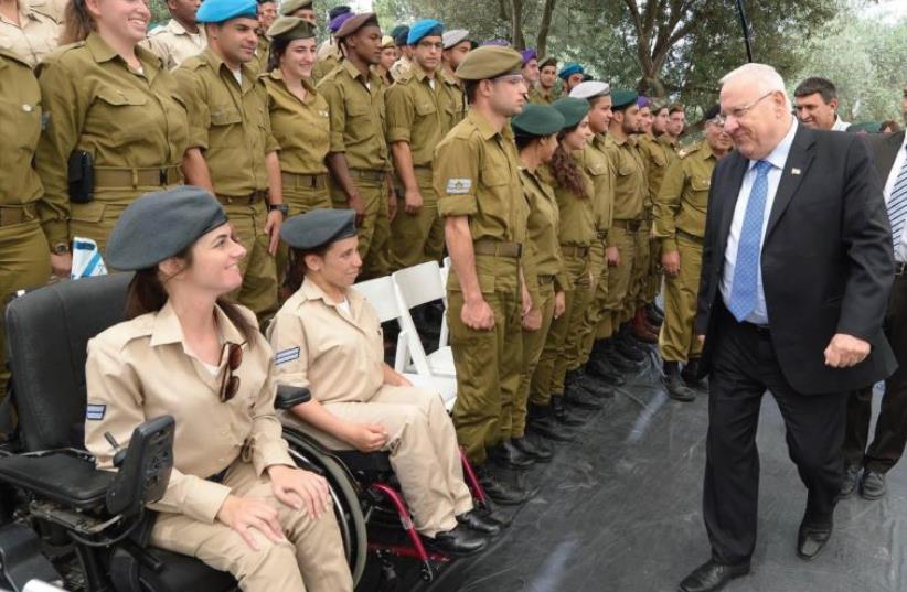 PRESIDENT REUVEN RIVLIN pays a surprise visit to some of the 120 outstanding soldiers who will be honored as part of the 68th Independence Day celebrations in Jerusalem (photo credit: MARK NEYMAN / GPO)