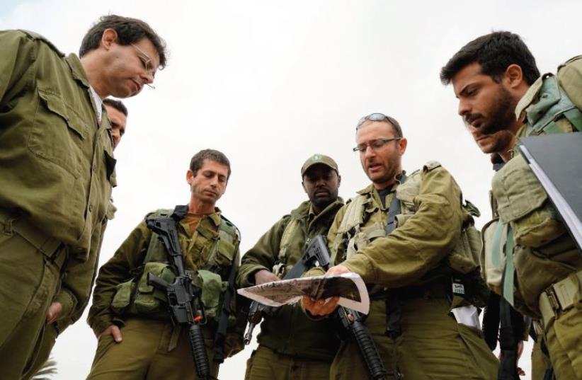 Members of the MIA research unit prepare to look for evidence of a missing soldier out in the field (photo credit: IDF)