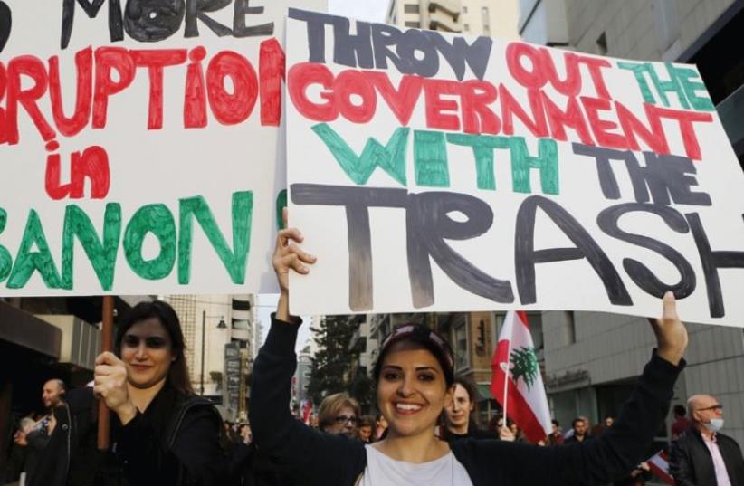 Demonstrators take part in a protest against the government’s failure to resolve a crisis over rubbish disposal in Beirut, March 12 (photo credit: REUTERS)