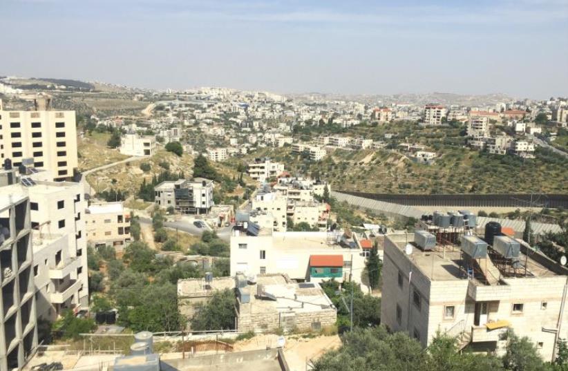 Palestinian houses line both sides of the road leading from Jerusalem to Gush Etzion (photo credit: JPOST STAFF)