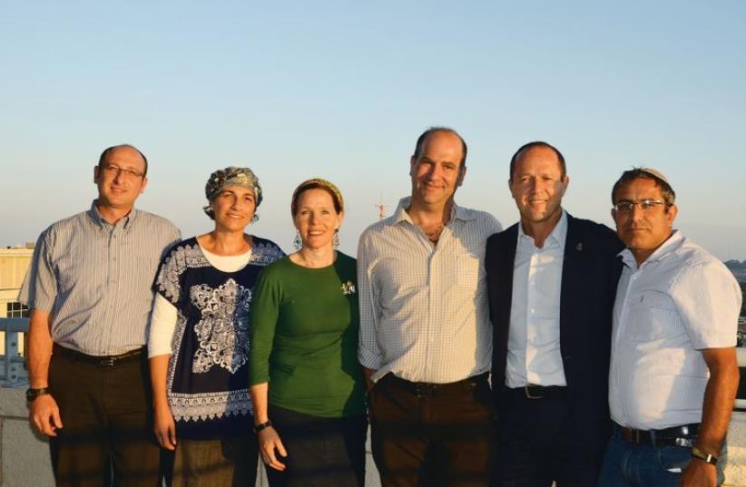 Mayor Nir Barkat (second from right) with the parents of the three murdered yeshiva students (photo credit: PR)
