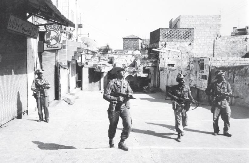 Soldiers patrol inside the Old City in 1967 (photo credit: JERUSALEM POST ARCHIVE)