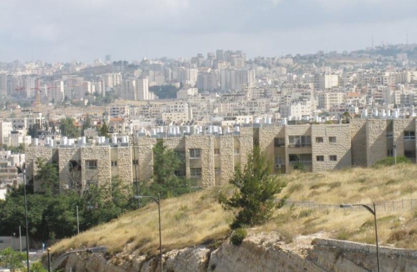 The Jewish neighborhood of Neveh Ya’acov with the settlement of Psagot in the background (photo credit: ANAV SILVERMAN)