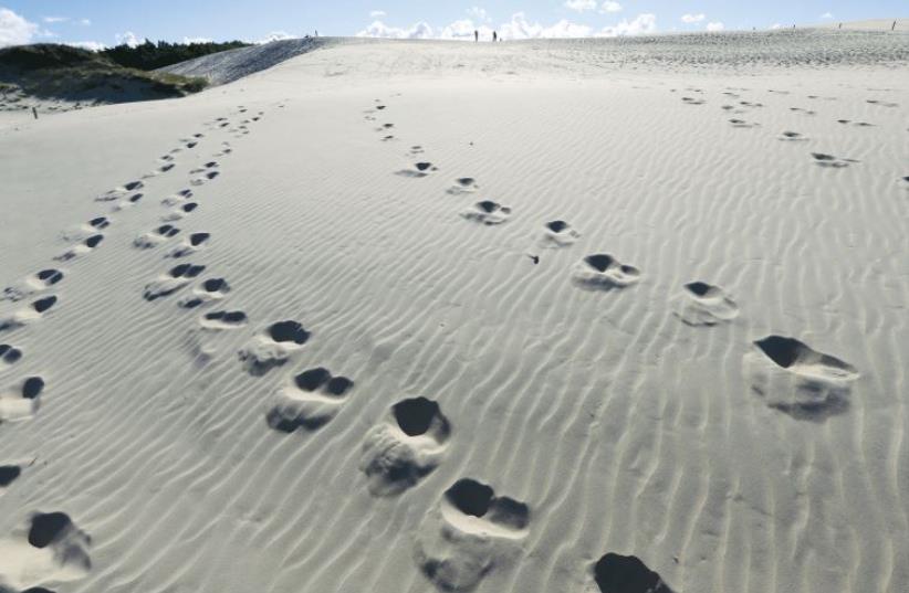 Footsteps on sand (illustrative) (photo credit: REUTERS)