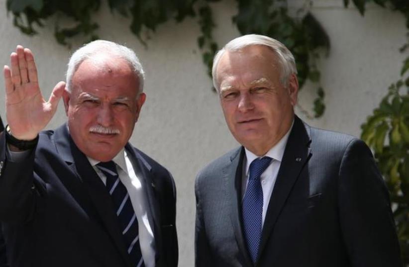 Palestinian Foreign Minister Riyad al-Maliki and French Foreign Minister Jean-Marc Ayrault. (photo credit: REUTERS)